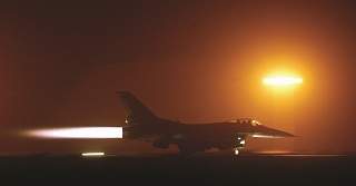 A USAF F16 FIGHTING FALCON PREPARES TO TAKE OFF FROM ITS BASE IN KUWAIT